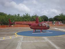 Robinson R44 aircraft parked on Leeward Islands Helicopters' St. Maarten Heli Pad